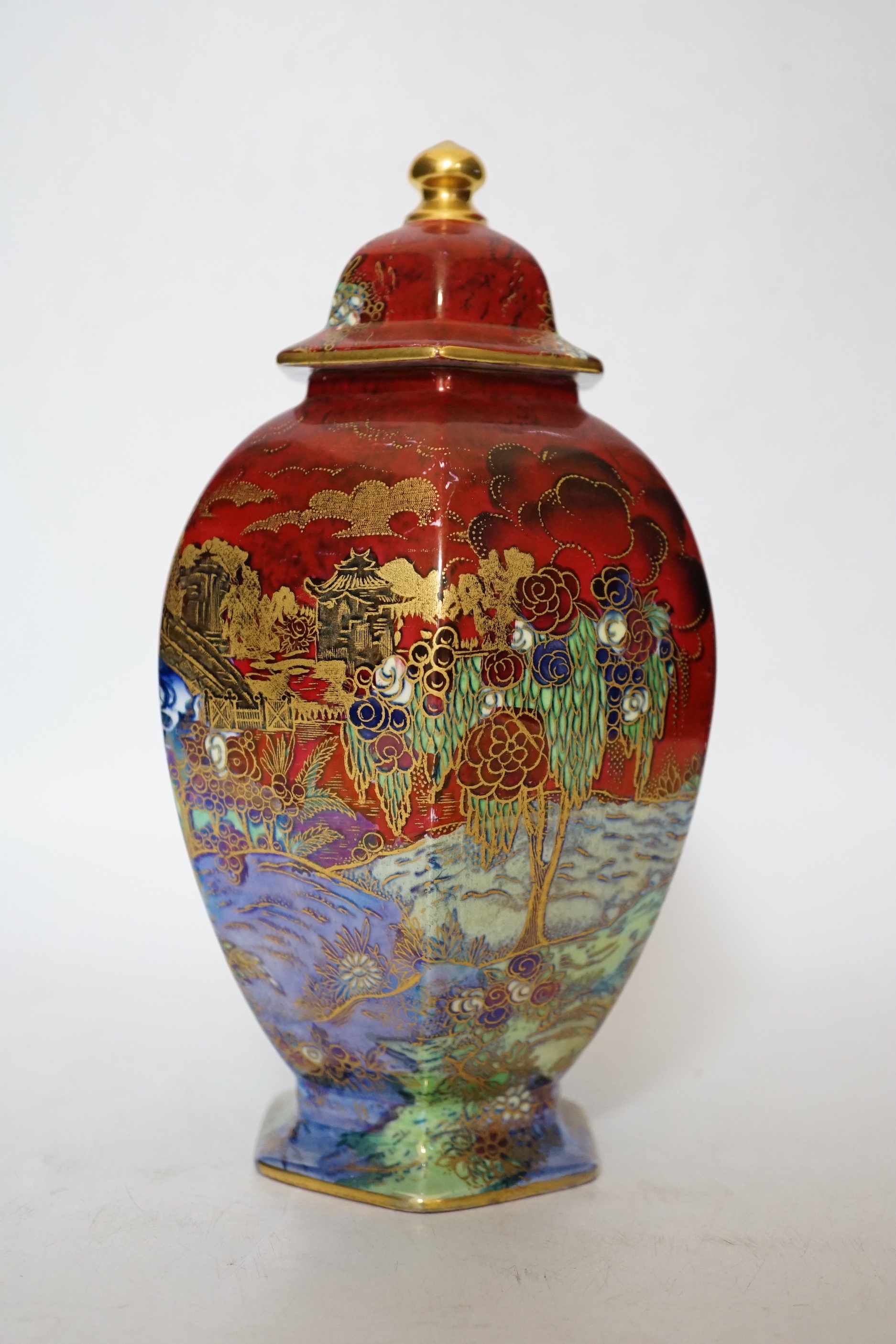 A Wilton ware lustre hexagonal lidded vase, numbered and stickered to underside A.G. Harley Jones, 23.5cm